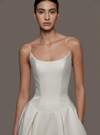 Vivienne duchess satin wedding dress with a boned bodice and covered buttons