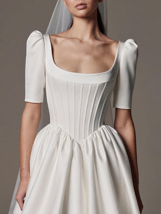 The Cecily duchess satin A-line wedding dress with puff sleeves, corset bodice, and cathedral train, made-to-measure by Sylk Atelier