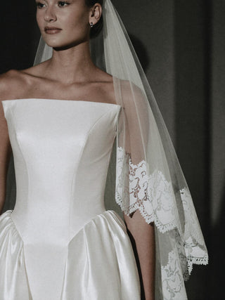Poise strapless mikado ball gown wedding dress with a boned corset bodice and cathedral train
