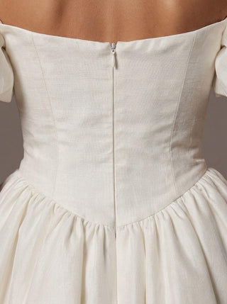 Made-to-measure Rowena A-line in silk dupion with off-shoulder puff sleeves and a corset bodice