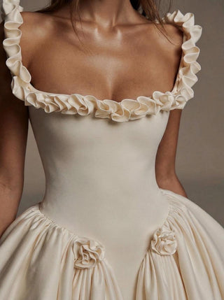 Pompadour duchess satin wedding dress with a lace-up corset back and hip rosettes
