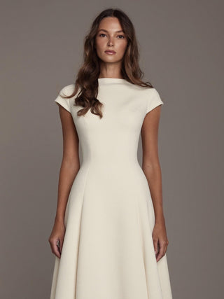 The Bronte stretch crepe cap sleeve A-line wedding dress with bateau neck and chapel train, made-to-measure by Sylk Atelier