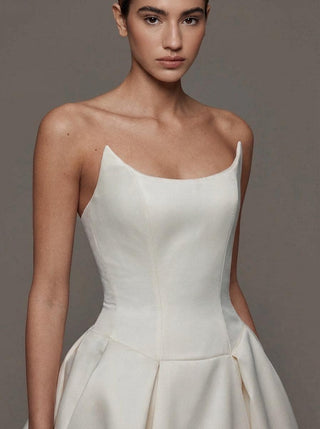 Vivienne duchess satin wedding dress with a boned bodice and covered buttons
