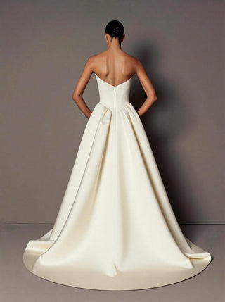 Chatsworth silk mikado wedding dress with a dropped basque waist and in-seam pockets