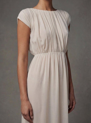 Lyra silk chiffon wedding dress with a bateau neck and cap sleeves