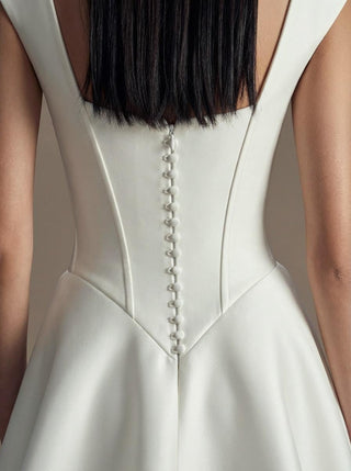 Rosalind duchess satin wedding dress with a visible corset bodice and a full skirt