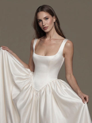 Verity duchess satin wedding dress with wide straps and a basque waist