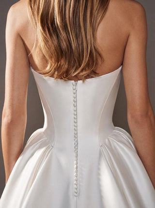 Linnet duchess satin ballgown wedding dress with a strapless sweetheart neckline and a visible corset