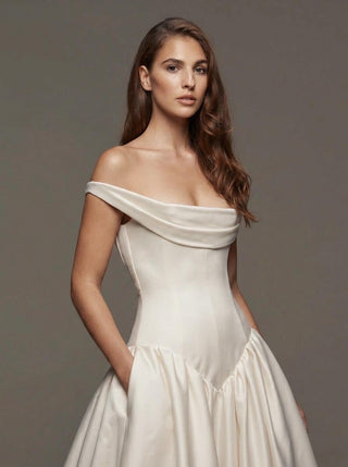 Cavendish silk mikado ballgown wedding dress with an off-shoulder cowl and a covered button back