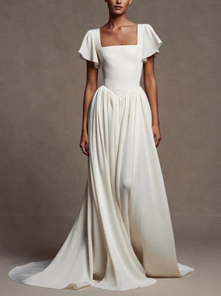 The Eglantine silk crepe wedding dress with flutter sleeves and georgette chapel train, made-to-measure by Sylk Atelier