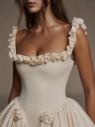 Pompadour duchess satin ballgown wedding dress with a ruffled neckline and a lace-up corset back