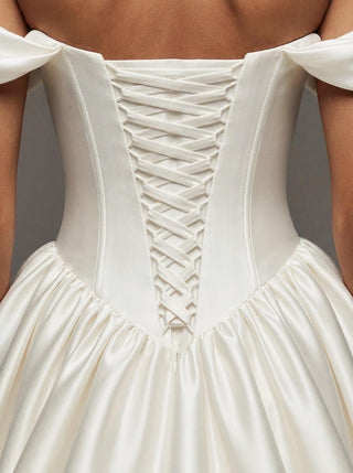Made-to-measure Araminta ballgown in duchess satin with a ruched sweetheart neckline and a lace-up back