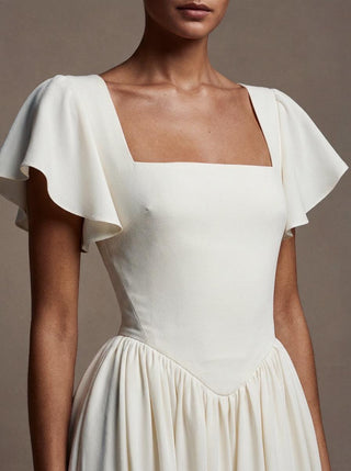 Made-to-measure Eglantine A-line in silk crepe with flutter sleeves and a georgette chapel train