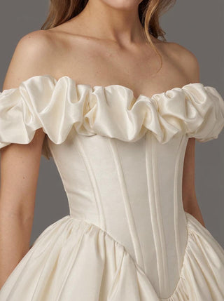 Made-to-measure Beaumont ballgown in duchess satin with a voluminous puff ruffle and a basque waist
