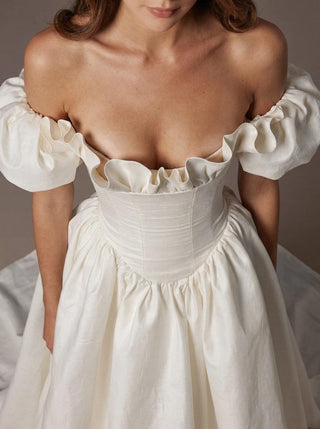 Made-to-measure Rowena A-line in silk dupion with off-shoulder puff sleeves and a corset bodice