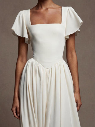 Eglantine silk crepe wedding dress with a boned bodice and a georgette chapel train