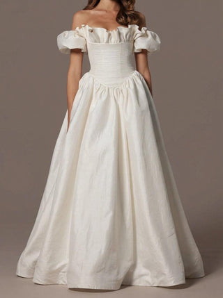 Rowena silk dupion wedding dress with a ruffled neckline and a corset bodice