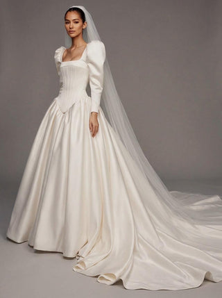 Made-to-measure Medici ballgown in duchess satin with long puff sleeves and an architectural corset