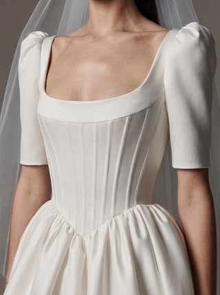 Made-to-measure Cecily A-line in duchess satin with short puff sleeves and a corset bodice