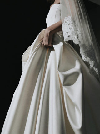 Made-to-measure Hever ball gown in duchess satin with a strapless corset bodice and deep side pockets