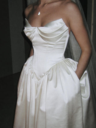 Sandringham duchess satin ball gown wedding dress with a draped sweetheart bodice and pointed basque waist