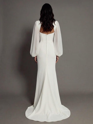 Made-to-measure Allegra mermaid in stretch crepe with sheer organza bishop sleeves and a high front slit