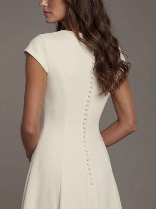 Bronte stretch crepe wedding dress with cap sleeves and a clean skirt