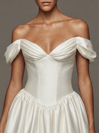 Araminta duchess satin wedding dress with a visible corset and a lace-up back
