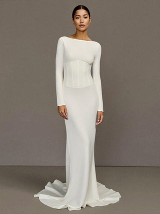 The Seraphine silk cady long sleeve fit and flare wedding dress with visible corset bones, made-to-measure by Sylk Atelier