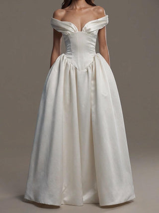 Fontaine duchess satin wedding dress with a corset bodice and a full gathered skirt