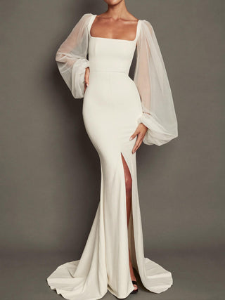 The Primrose stretch crepe mermaid wedding dress with silk tulle bishop sleeves and front slit, made-to-measure by Sylk Atelier