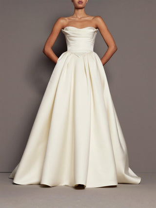 Chatsworth silk mikado wedding dress with a dropped basque waist and in-seam pockets