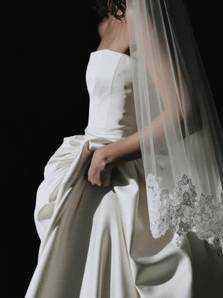 Hever strapless duchess satin ball gown wedding dress with a boned corset bodice and cathedral train