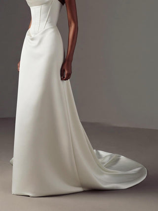 Made-to-measure Celestine A-line in duchess satin with a strapless scoop neckline and a dropped basque waist