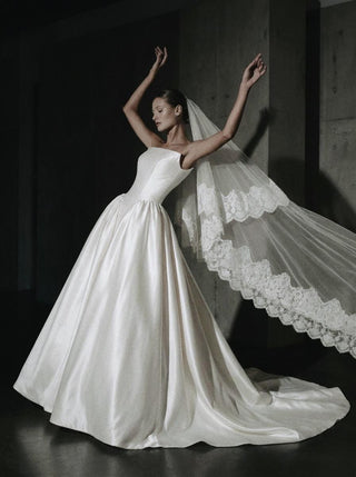 Poise strapless mikado ball gown wedding dress with a boned corset bodice and cathedral train
