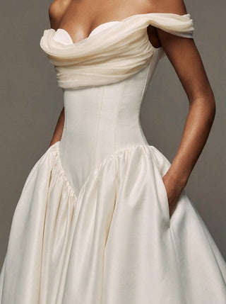 Wilderness silk faille ballgown wedding dress with an off-shoulder corset bodice and an organza overskirt