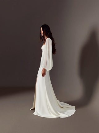 Made-to-measure Allegra mermaid in stretch crepe with sheer organza bishop sleeves and a high front slit