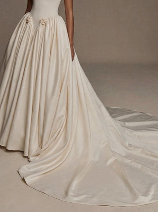 Pompadour duchess satin wedding dress with a lace-up corset back and hip rosettes