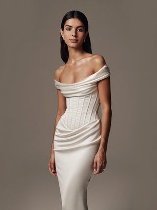 Constance silk satin wedding dress with a corset bodice and a draped hip