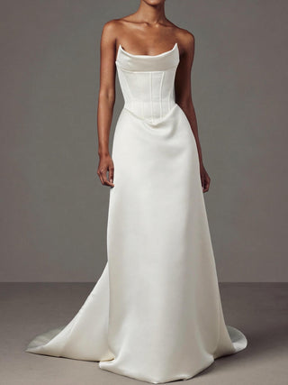 Celestine duchess satin wedding dress with a visible corset and a dropped basque waist