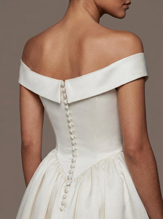 Made-to-measure Stratford ballgown in mikado with a portrait collar and covered buttons