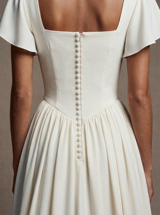 Eglantine silk crepe wedding dress with a boned bodice and a georgette chapel train