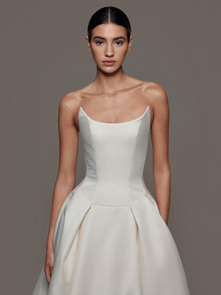 The Vivienne boned strapless duchess satin ballgown with pleated skirt and chapel train, made-to-measure by Sylk Atelier