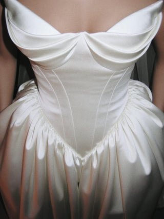 Sandringham duchess satin wedding dress with a full pannier skirt and covered button back to the hip