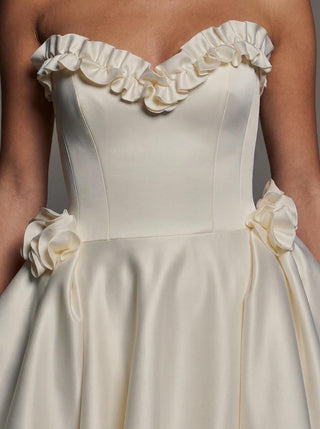 Georgiana duchess satin ballgown wedding dress with a ruffled sweetheart neckline and hip rosettes